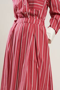 A striped woven full skirt with side zipper closure. Matching Top FT1310. Details: Self : 70% Cotton 27% Nylon 3% SpandexContrast : 100% Polyester Size & Fit - Model is 5`8" And Wearing Size Small- Measurements Taken From Size Small- Approx. Length: 33" Chic Striped Lined Skirt Bottoms, Striped Midi Skirt For Work, Striped Lined Skirt Bottoms For Workwear, Striped Lined Skirt For Workwear, Spring Striped Flared Skirt, Relaxed Skirt With Striped Hem, Summer Workwear Skirt With Vertical Stripes, Chic Striped Long Skirt, Chic Long Striped Skirt