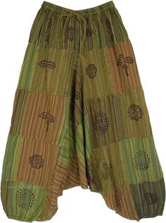 A comfortable, loose-fit pair of unisex, baggy, free-flowing bohemian drop crotch pants in woven cotton fabric with a flexible elastic waist, elastic bottom, and mystic symbols printed on striped patchworks.  These are also called Aladdin pants and wide-cut genie pants, and work well for both men and women and they rock on any body type. #tlb #SplitSkirtsPants #Patchwork #Yoga #vacationclothing #beachwrap #Striped #bohemianfashion #Handmade #AladdinPants #DropCrotchpants #HaremPants #UnisexPants Green Baggy Harem Pants In Hippie Style, Baggy Green Hippie Harem Pants, Green Bohemian Harem Pants With Loosely Fitted Hips, Bohemian Green Harem Pants With Loose Fit, Green Bohemian Harem Pants, Bohemian Green Wide Leg Harem Pants, Bohemian Cotton Wide-leg Harem Pants, Bohemian Green Wide-leg Harem Pants, Cotton Wide-leg Harem Pants For Festivals