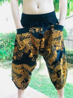 "Male Model Tall 5'9\" Waist 34\" Samurai Pants - elastic waistband and cuffs - Fits all! Unisex pants These beautiful casual pants is unique & comfortable to wear Handmade with a very lovely pattern, it is easy to wear and great for many occasions. One size fits most. These pants are great for many different activities like traveling, dancing, going to festivals, rock climbing, yoga, meditation, massage, working out, martial arts, Taichi MATERIAL: 100% Cotton APPROX MEASUREMENT: Waist: 24\" Harem Pants With Pockets For Festivals, Casual Pants With Pockets For Festivals, Casual Wide Leg Harem Pants For Festivals, Casual Festival Pants With Pockets, Traditional Pants With Elastic Waistband For Festivals, Festival Harem Pants With Pockets, Casual Baggy Harem Pants For Festivals, Casual Pants With Elastic Waistband For Festivals, Casual Wide Leg Pants For Festivals