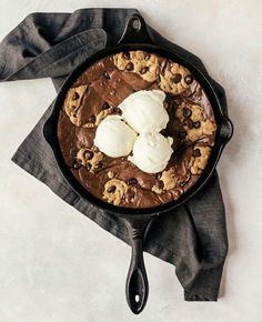 a skillet with ice cream and cookies on it, ready to be served in the oven