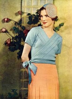 an old fashion photo of a woman wearing a blue sweater and orange pleated skirt