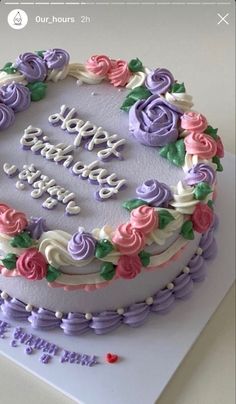 a birthday cake decorated with flowers and words