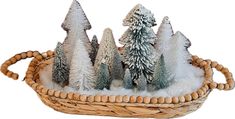 small christmas trees in a wicker basket