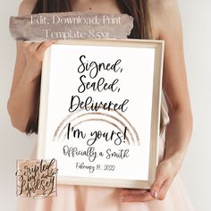 a woman holding up a sign that reads, send sealed deliver i'm yours