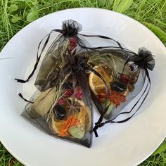 two bags filled with fruit sitting on top of a white plate