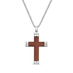 He'll enjoy the meaning and message of this wood-inlay cross necklace. Crafted in stainless steel A curved wood inlay adorns the cross pendant Capped ends create a contemporary look The 24-inch box chain secures with a lobster clasp Gift Cross Pendant Necklace With Polished Finish, Stainless Steel Cross Pendant Necklace For Gift, Gift Stainless Steel Cross Pendant Necklace, Engraved Cross Pendant Necklaces For Collectors, Wood Cross Necklace Men, Curved Wood, Wood Inlay, Accessories Jewelry Necklace, Box Chain