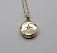 "A gold vermeil locket opens to hold two photographs.  It features a tiny cubic zirconia crystal in the center of a Northstar design. ~16-18\" adjustable gold vermeil chain ~Locket measures 3/4\" ~Gold vermeil is sterling silver plated in 18 carat gold" Cheap Gold Medallion Locket Necklace, Cheap Medallion Locket Necklace, Luxury Elegant Locket Necklace With Oval Pendant, Sun Locket, Unique Locket Necklace, Golden Locket, Unique Locket, Chain Locket, Locket Vintage