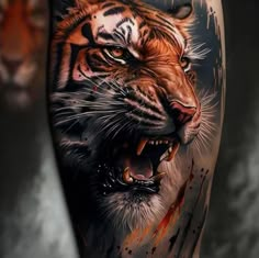 a tiger with its mouth open and blood splattered on it's leg