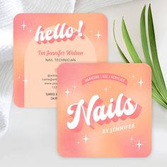 two business cards with the word nails on them and a plant in front of it