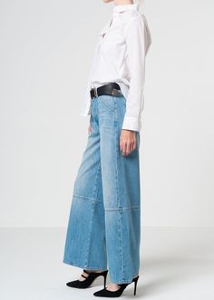 These voluminous yet supple wide leg jeans boast an artfully spliced silhouette and a medium light blue wash in a rigid soft denim fabric for a luxurious look. Model is 5'10" wearing size 26. Approx. Front rise: 11.5" Inseam: 30.5"Approx. Knee: 23.25" Leg opening: 22.5" 100% CottonMade in USA Fits true to size. Baggy Shorts, Kick Flares, Jumpsuit Jacket, Price Match, Denim Fabric, Denim Top, Men's Collection, Independent Designers Fashion, Wide Leg Jeans