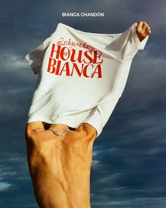 a person holding up a t - shirt with the words house blancca on it