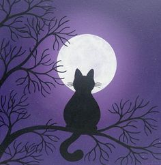 a black cat sitting on top of a tree branch in front of a full moon