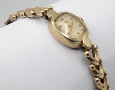 Vintage Elgin Deluxe ladies wristwatch. Elegant design in polished gold tone finish. Spring wound mechanical movement. Linked chain bracelet style band with gold tone and stainless-steel elastic portion.  Good condition. Mechanically fully serviced and working great. Your watch will be shipped safely in a custom gift box suitable for presentation. Deck Vintage strives on being a source for authentic vintage and historic items in the best condition possible. Any flaws or wear will be visible in photos, any significant or hard to see flaws will be mentioned in description. All watches are cleaned, with all moving parts serviced and fully tested. Feel free to message me for any questions you may have, I'm easy to talk to. Although your item will be mindfully packaged, there is always a chance Theatrical Romantic, Ladies Bracelet Watch, Presentation Deck, Antique Watch, Ladies Bracelet, Custom Gift Boxes, Antique Watches, Bracelet Style, Mechanical Movement