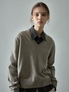 This sweater offers a luxurious and versatile addition to your wardrobe. It is made with cashmere blended fabric with a basic loose silhouette allowing for various stylings.- Suitably deep V-neck design- Excellent insulation and smooth, elegant texture- Suitable for year-round wear, except for summer Grey V Sweater, Elegant Cashmere V-neck Sweater For Work, Elegant V-neck Sweater For Business Casual, Cashmere V-neck Sweater For Work, Elegant V-neck Sweater For Layering, Elegant Cashmere V-neck Sweater, Elegant Solid Color V-neck Sweater For Work, Business Casual V-neck Wool Sweater, Classic Solid V-neck Sweater For Layering