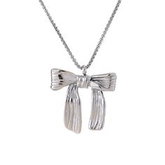 Tie up your look in style with the Zoe Necklace. This fashion-forward piece features a chic bow knot pendant, crafted from gleaming 18k gold-plated stainless steel. Lightweight, hypoallergenic, and water-resistant, it's the perfect everyday necklace that adds a touch of feminine flair to any outfit. 18k Gold-Plated Stainless Steel Polished Bow Knot Pendant Lightweight & Hypoallergenic Tarnish-Resistant 16.25" + 2" extender Chic Metal Jewelry With Bow Detail, Chic Silver Jewelry With Bow Tie Detail, Chic Butterfly Knot Jewelry Gift, Chic Ribbon Necklace Perfect For Gifts, Chic Jewelry With Bow For Gift, Chic Ribbon Jewelry As A Gift, Chic Jewelry With Ribbon For Gift, Chic Ribbon Necklace For Gift, Chic Ribbon Jewelry For Gifts