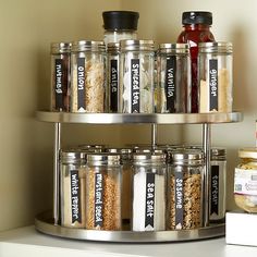 an organized spice rack with spices and condiments