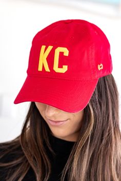 Put on your game face with our KC Cap in red and yellow. Featuring bold embroidery in chiefs colors, this cap is perfect for the ultimate fan. Go chiefs! Snap-back adjustable. Red Adjustable Baseball Cap For Game Day, Red Baseball Cap For Game Day, Red Collegiate Baseball Cap For Baseball Season, Red Collegiate Baseball Cap For Sports, Red Baseball Cap For Baseball Season, Red Baseball Cap For Sports Fans, Red Snapback Hat For Baseball Season Game Day, Red Snapback Hat For Baseball Game Day, Red Curved Brim Baseball Cap For Fans