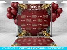 a red backdrop with balloons and palm leaves on it for a wedding or anniversary party