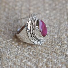 Gemstone-Indian Ruby Gemstone Shape-Teardrop Metal-925 Sterling Silver This One of a kind ring is adorned with beautiful Indian Ruby Gemstone set in sterling silver. About gemstones-Ruby is the stone of nobility,passion,wealth and protection.Ruby promotes inner peace, positive state of mind ,courage and motivation to its wearer. Ruby possess intense energy which sharpens the mind thereby bringing good concentration. It helps to reduce fear of evil and protect against psychological attacks. It en Star Ruby Ring, Red Gemstone Ring, Handmade Silver Ring, Red Gemstones, Silver Work, Silver Rings Handmade, Red Ruby, Ruby Ring, Favorite Rings