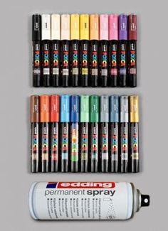 several different colors of permanent markers next to each other on a gray background with the same marker