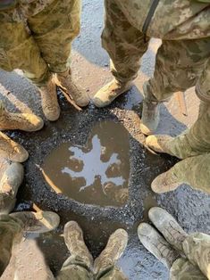 several soldiers standing in a circle with their feet on the ground