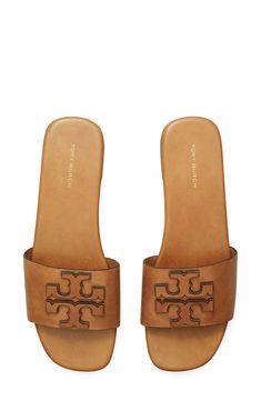 Dimensional logo detailing stands out atop the vamp of this laid-back leather slide sandal. Flat sole Leather upper, lining and sole Imported Calf Leather Slip-on Sandals With Cushioned Footbed, Luxury Slides With Leather Footbed And Calf Leather, Luxury Slides With Calf Leather Footbed, Luxury Calf Leather Slides With Leather Footbed, Tan Leather Footbed Slip-on Sandals, Classic Slides With Calf Leather Footbed, Classic Open Toe Calf Leather Slides, Classic Slides With Removable Insole, Classic Slides With Leather Footbed