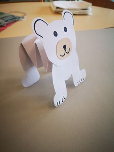 a paper cut out of a polar bear