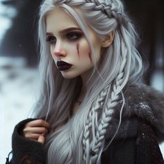 a woman with long white hair and black makeup is standing in the snow wearing an elaborate braid