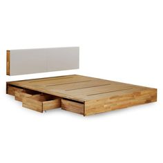 a bed with two drawers and a headboard made out of wooden planks on top of it