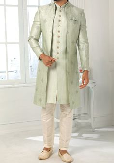 Readymade Art Silk Sherwani, and Jacket. Art Dupion Aligarhi Ready Made Trouser. Resham, Sequences, and Zari Work. Crafted in Chinese Collar Neck, and Full Sleeve. Faux Satin Lining with Plain Work. High-Quality Matching Buttons. Please Note: The footwear shown in the picture is for presentation and photography purpose only. Color: There might be slight color variation due to lightings and flashes while photo shooting. The color may also vary because of different screen resolutions. Wash Care: D Elegant Front Open Kurta With Zari Work, Elegant Front-open Kurta With Zari Work, Elegant Front Open Kurta For Eid, Fitted Long Sleeve Bandhgala For Eid, Long Nehru Jacket With Dabka For Wedding, Straight Kurta Outerwear For Eid, Straight Kurta For Eid Festivities, Fitted Suit With Dupatta In Traditional Drape, Festive Outerwear With Dupatta For Eid