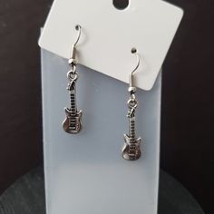 This adorable earrings are perfect for a Guitar lover. Great for a rock concert.  24 x 7 mm Nickel-free Punk Jewelry For Concerts, Punk Style Nickel-free Jewelry For Concerts, Punk Style Nickel-free Jewelry, Edgy Nickel-free Earrings For Gift, Adjustable Silver Jewelry For Concert, Adjustable Silver Jewelry For Concerts, Edgy Pierced Earrings For Concerts, Nickel Free Edgy Plug Earrings As Gift, Edgy Nickel-free Plug Earrings As Gift