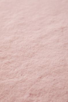 the pink carpet is very soft and fluffy with little bumps on it's surface