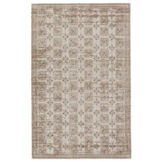 a beige and brown rug with an intricate design on the bottom, in front of a white background