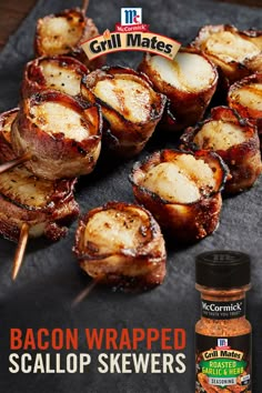 bacon wrapped scallop skewers on a slate board with the title grill mates