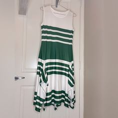 Cute Summer White & Green Dress With Asymmetrical Hemline. Dress Is Nwot In Size Large. It Has Never Been Worn. Reasonable Offers Accepted . Dress Is Approximately: 18” Pit To Pit 42” At The Longest Hemline Thanks For Looking And Happy Poshing! White Asymmetrical Maxi Dress For Vacation, Asymmetrical White Maxi Dress For Vacation, White Asymmetrical Midi Dress For Vacation, White Asymmetrical Hem Midi Dress For Vacation, Green Midi Dress With Asymmetrical Hem For Vacation, White Asymmetrical Hem Midi Dress For Beach, White High-low Hem Maxi Dress, Green Asymmetrical Midi Dress Casual, Green Asymmetrical Midi Dress Casual Style