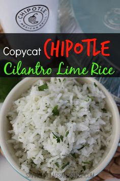 a white bowl filled with rice next to a cup of coffee on top of a table