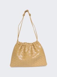 Find BOTTEGA VENETA Medium Dustbag on Editorialist. The Bottega Veneta Medium Dustbag is crafted from lambskin leather and features a single main compartment, a drawstring closure with a leather loop attachment for shoulder carry, and a transformable strap. The dimensions are one size. Care for this bag according to the label. New Bottega, Care Care, Bottega Veneta Intrecciato, Leather Pouch, Green Bag, White Bag, Lambskin Leather, Small Bag, Bottega Veneta