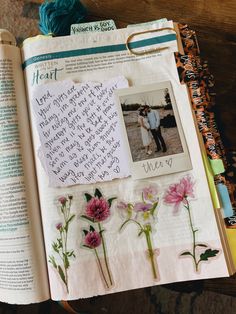 an open book with pictures and flowers on it