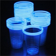 six plastic cups with blue light up lids