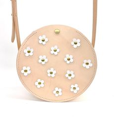 Our fun-loving leather Bloom Around Town bag is sure to add a little pep to your step. Adorned with daisies in your choice of colorful leather, it's perfect for every occasion. Follow along @gladadnyoungstudio. Summer Gift Leather Bags, Summer Leather Bag For Gift, Summer Leather Bags For Gifts, Spring Shoulder Bag With Removable Pouch And Round Handle, Spring Gift Leather Shoulder Bag, Spring Leather Shoulder Bag Gift, Handmade Round Bag For Everyday Use, Spring Leather Shoulder Bag For Gift, Leather Shoulder Bag With Round Handle For Spring