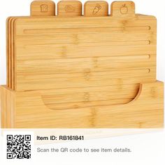 a bamboo cutting board with six sections cut out to look like it is holding scissors and other items