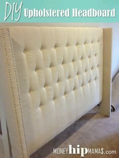 an upholstered headboard with nail polishing on the sides and buttons at the bottom