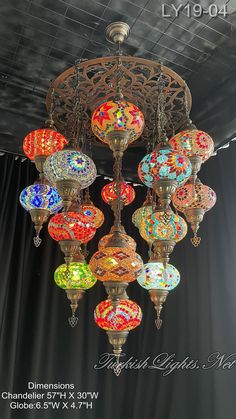 a chandelier with many colorful lights hanging from it