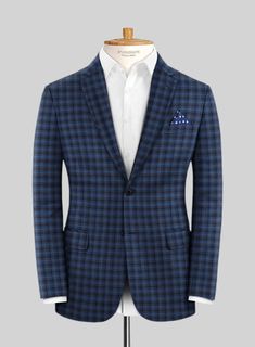 Exuding unparalleled style and charm, our Reda Mid Blue Checks Wool Suit provides everything the modern man desires. Crafted from pure wool fibers, this suit boasts an ultra-smooth and comfortable finish. The deep mid-blue shade and checked pattern give a unique vibe to the outfit. Whether you wear it to a formal event or a wedding, you'll certainly grab all the attention you need. 
  Look Includes    Reda     Mid     Blue     Checks     Wool  Fabric  Two Button Jacket Style  Notch Lapel   Horn Business Blazer With Suit Collar In Royal Blue, Royal Blue Business Blazer With Suit Collar, Blue Business Casual Blazer In Suiting Fabric, Royal Blue Long Sleeve Business Suit, Blue Wool Suits For Work, Blue Wool Suits For Workwear, Tailored Blue Wool Suit, Navy Wool Suits For Business Casual, Tailored Royal Blue Suits For Business