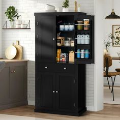 a black cabinet with glass doors in a kitchen