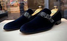 Materials Upper: LeatherLining: LeatherSole : Leather Indulge in refined elegance with our navy-blue men's dress slip-on loafers, featuring a luxurious velvet exterior and a sumptuous all-leather interior and sole. This sophisticated pair combines opulence with comfort, ensuring a lavish experience with every step.The meticulously designed buckle, crafted from genuine patent leather, graces the upper, adding a touch of exclusivity to this already exquisite pair. This unique buckle serves as a sy Luxury Slip-on Dress Shoes For Semi-formal Occasions, Designer Formal Slip-ons, Elegant Blue Monk Strap Shoes With Leather Sole, Formal Blue Slip-ons With Leather Sole, Blue Formal Slip-ons With Leather Sole, Luxury Slip-ons For Formal Occasions, Elegant Blue Slip-on Monk Strap Shoes, Elegant Blue Formal Dress Shoes, Luxury Semi-formal Slip-ons