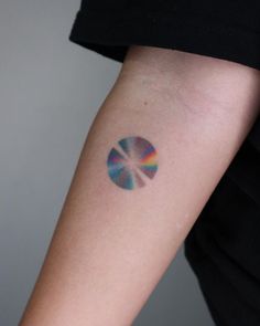 a person with a colorful tattoo on their arm