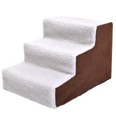 a set of white and brown carpeted stairs