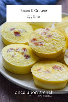 bacon and gruyre egg bites on a plate with text overlay that reads, once upon a chef