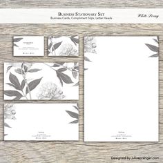 the business stationery set is shown with flowers and leaves